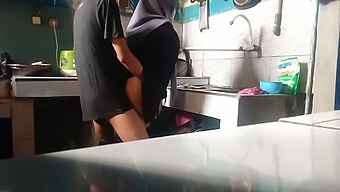A cute stepsister has sex with her man while washing dishes